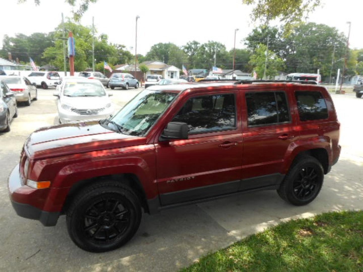 2016 RED JEEP PATRIOT SPORT (1C4NJRBB5GD) , located at 10405 Abercorn Street, Savannah, GA, 31419, (912) 921-8965, 31.988262, -81.131760 - Photo#1